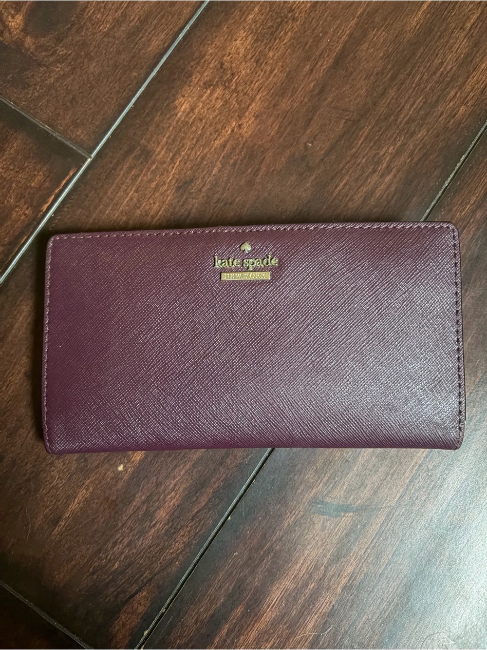kate spade plum Saffiano continental wallet with gold logo